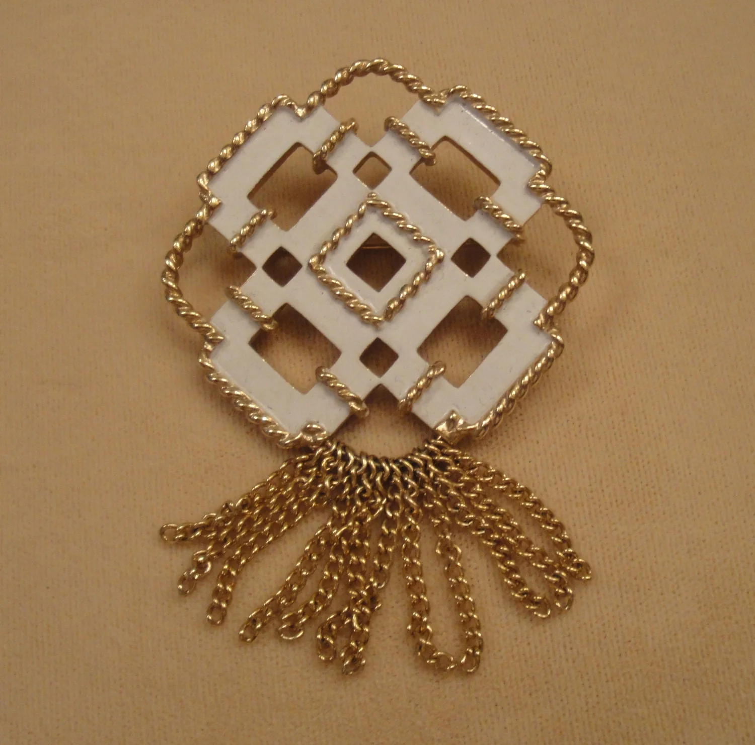 Brooch Creamy White Enamel with Rope Like Gold Tone Trim and Tassels 70s 1 and 3/4 by 1 and 3/4 Inches Plus 1 Inch Center Tassels by Avon - Image 3